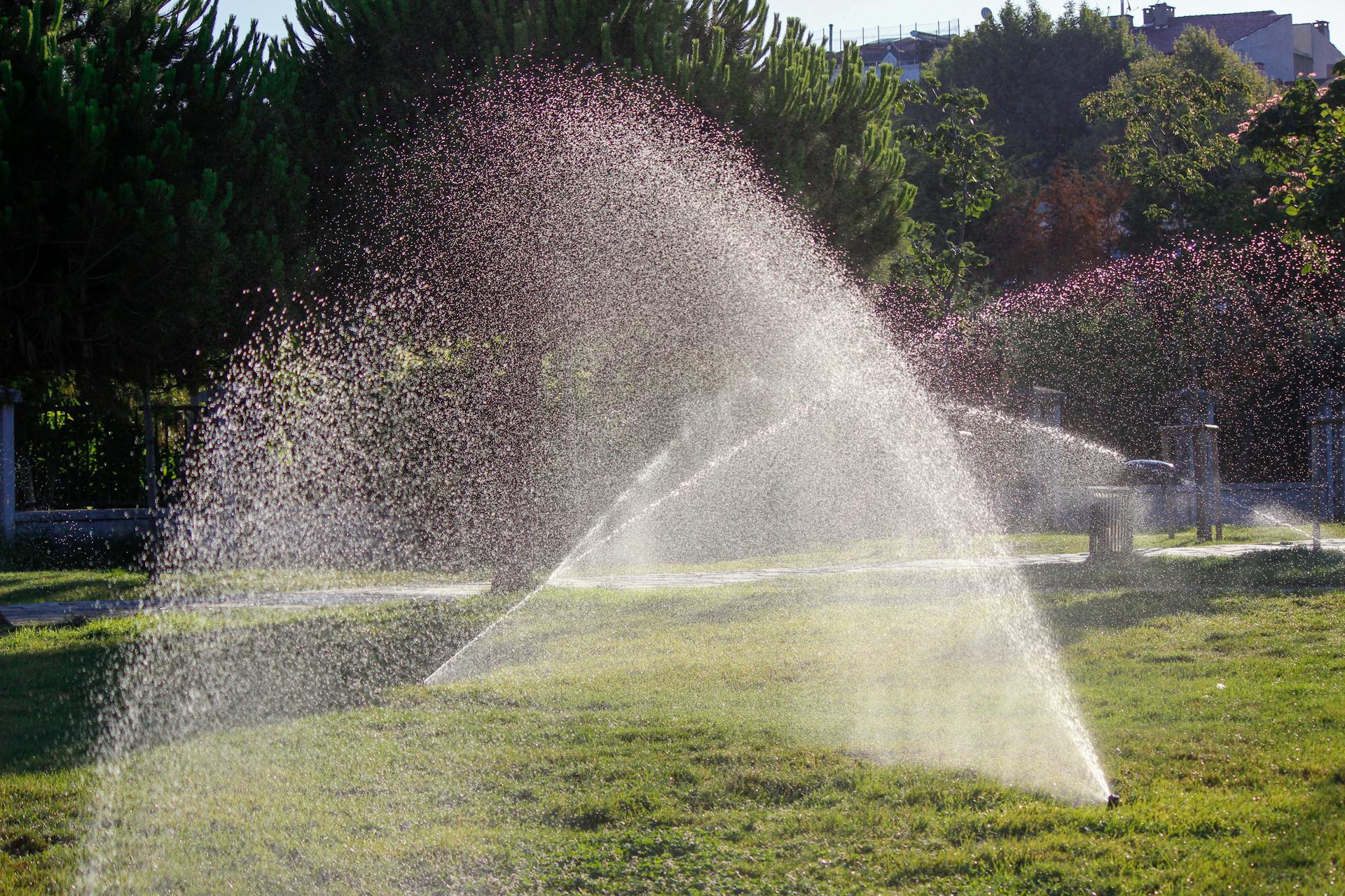 Irrigation sprinkler system watering residential lawn